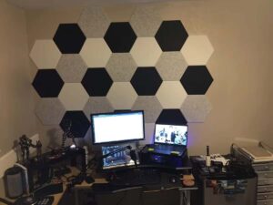 Hexagonal decorative acoustic panels in multiple colours on the wall