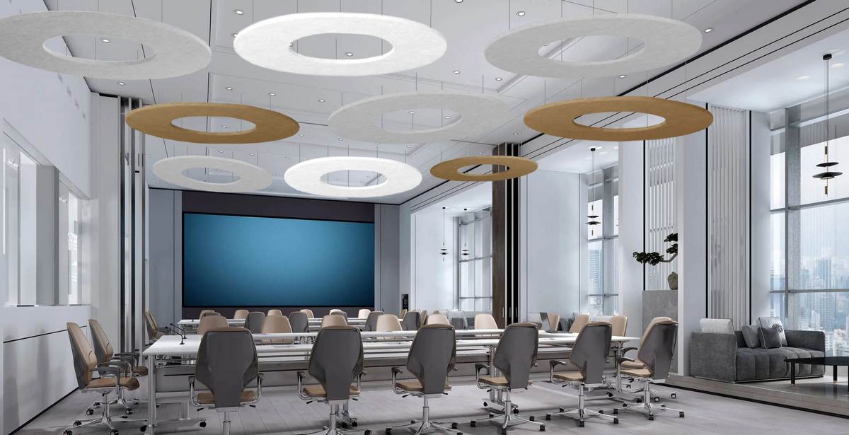 Acoustic ceiling clouds installed above a modern meeting room table
