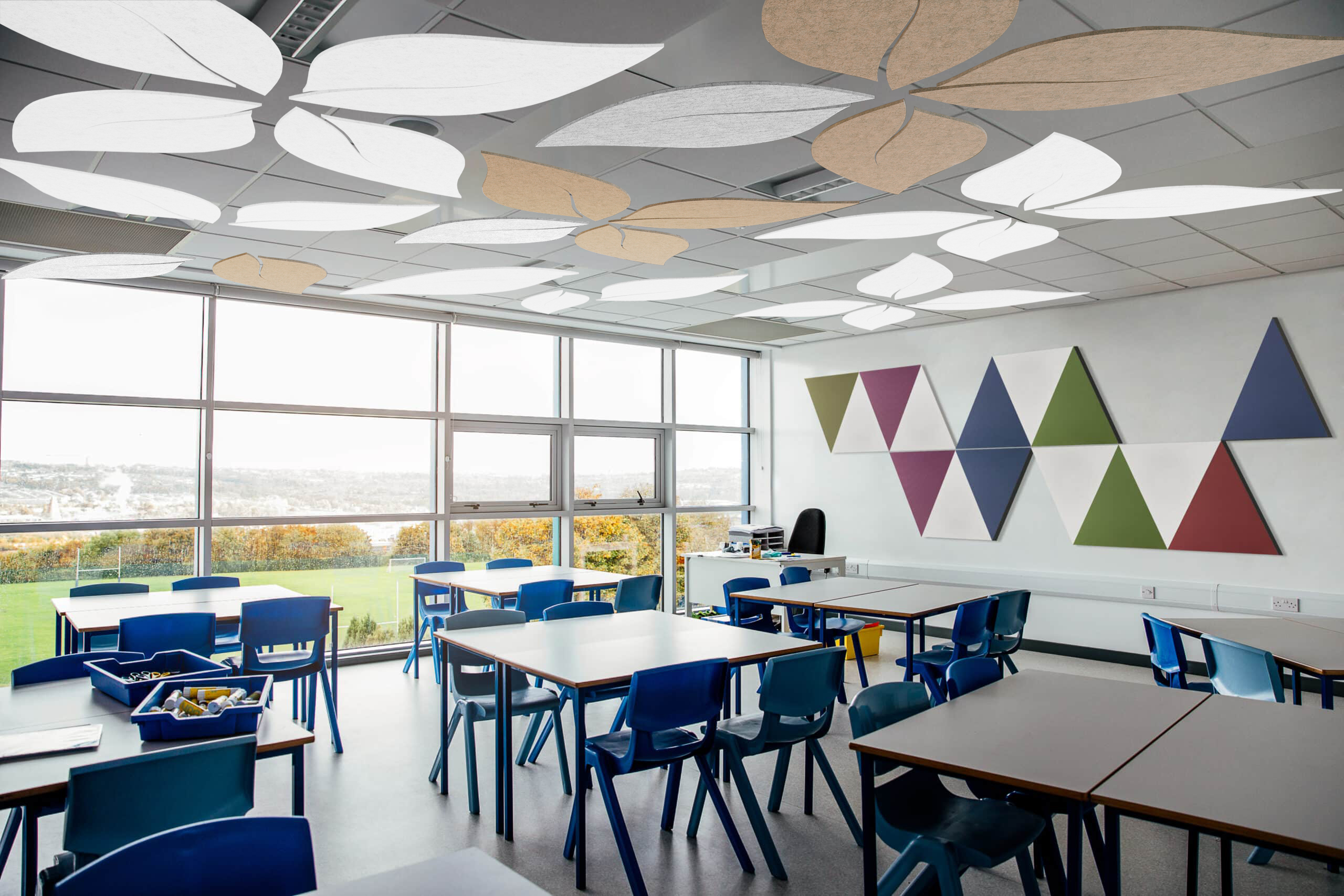Leaf-shaped suspended ceiling sound-absorbing panels in a bright classroom
