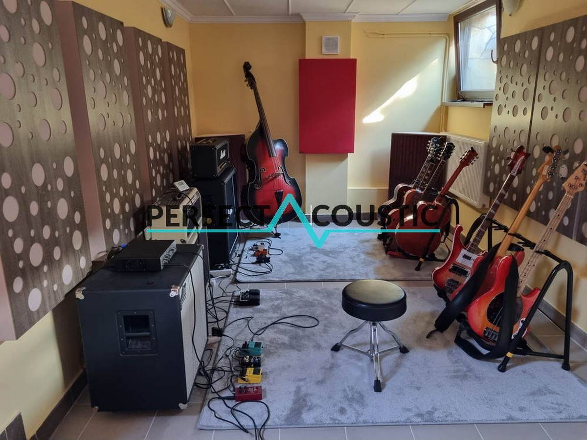 Music rehearsal space with guitars and studio panels acoustic