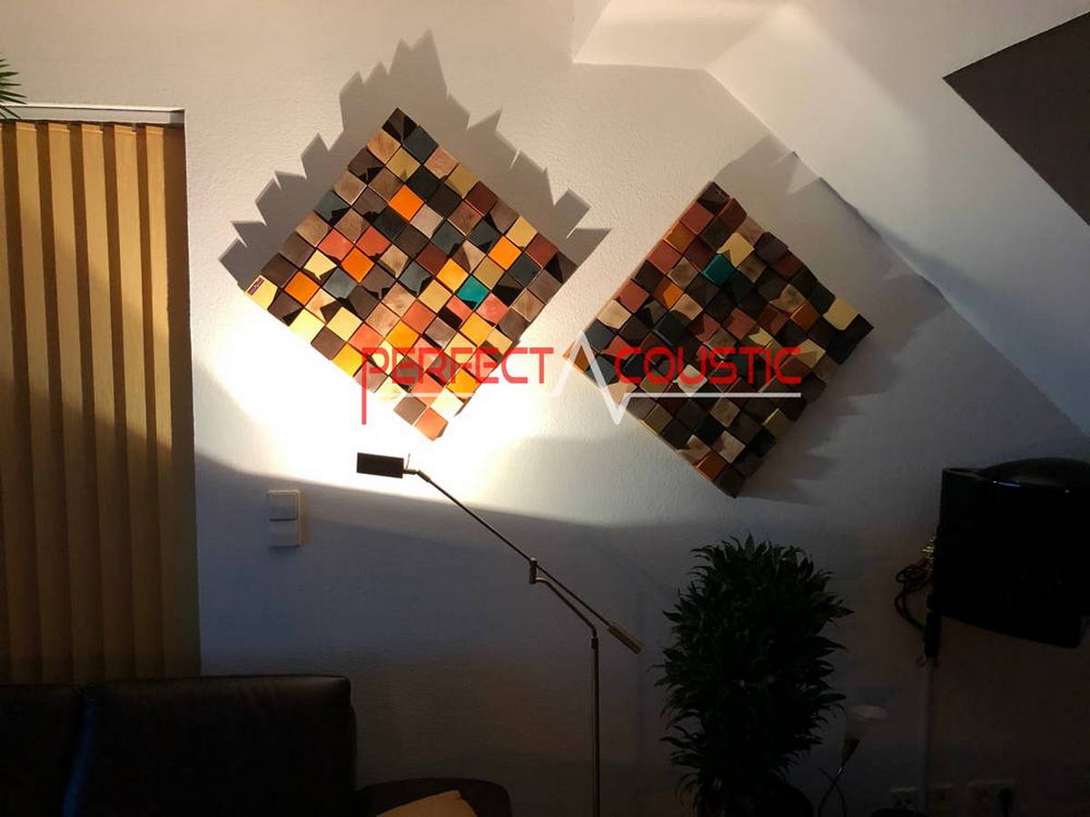 Custom wooden acoustic diffuser panels arranged in a geometric pattern on a living room wall.