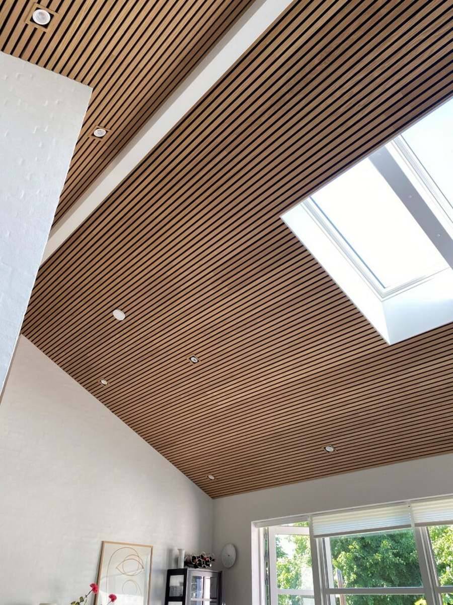 Wooden slatted ceiling design with integrated sound insulation